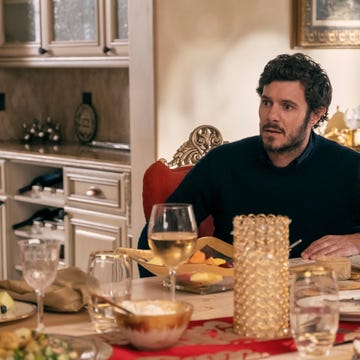 Dining table setting with various dishes and drinks.