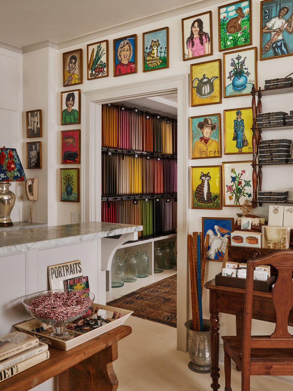 a vibrant art studio with colorful wall decor and organized materials