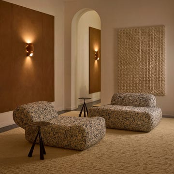 Modern interior with contemporary furniture and textured wall elements. Modern interior with contemporary furniture and textured wall elements.