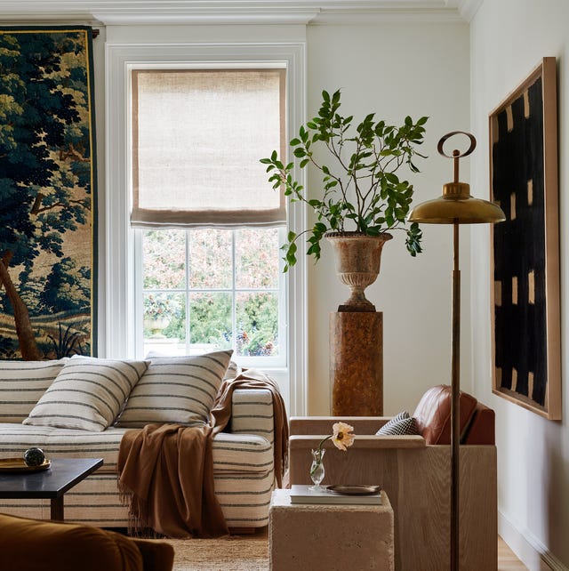 A cozy living room featuring a contemporary design with a mix of textures and natural elements A cozy living room featuring a contemporary design with a mix of textures and natural elements