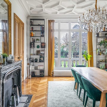 Elegant dining area with modern decor and access to a garden view