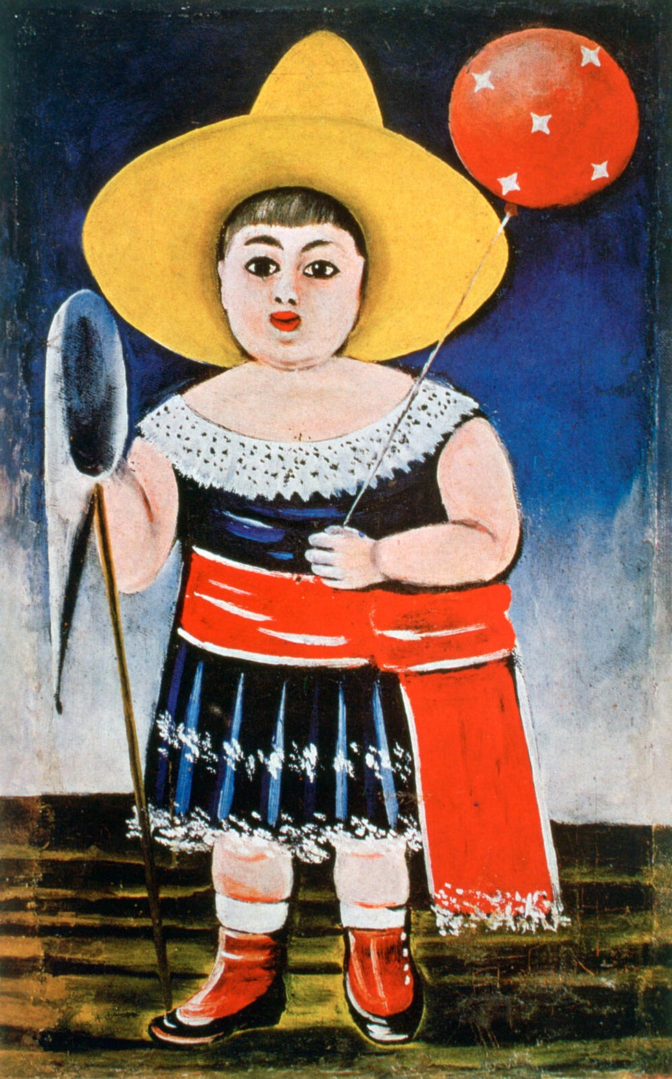 A child wearing a traditional outfit holds a balloon.