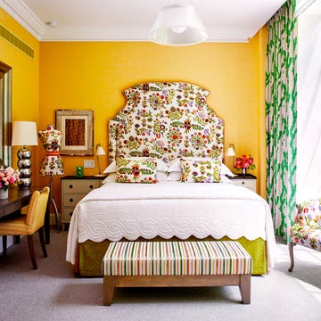 Decorative bedroom with vibrant colors and floral patterns.