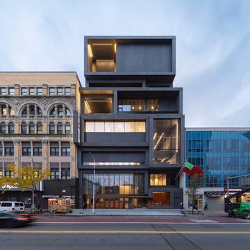 Contemporary building adjacent to historical architecture in urban setting