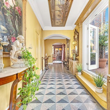 Elegant corridor featuring decorative elements and natural light.