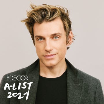 A-List 2024 - ELLE DECOR a blond man with a black t shirt and green tweek blazer