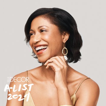 A-List 2024 - ELLE DECOR a woman smiling with his hand on her chin