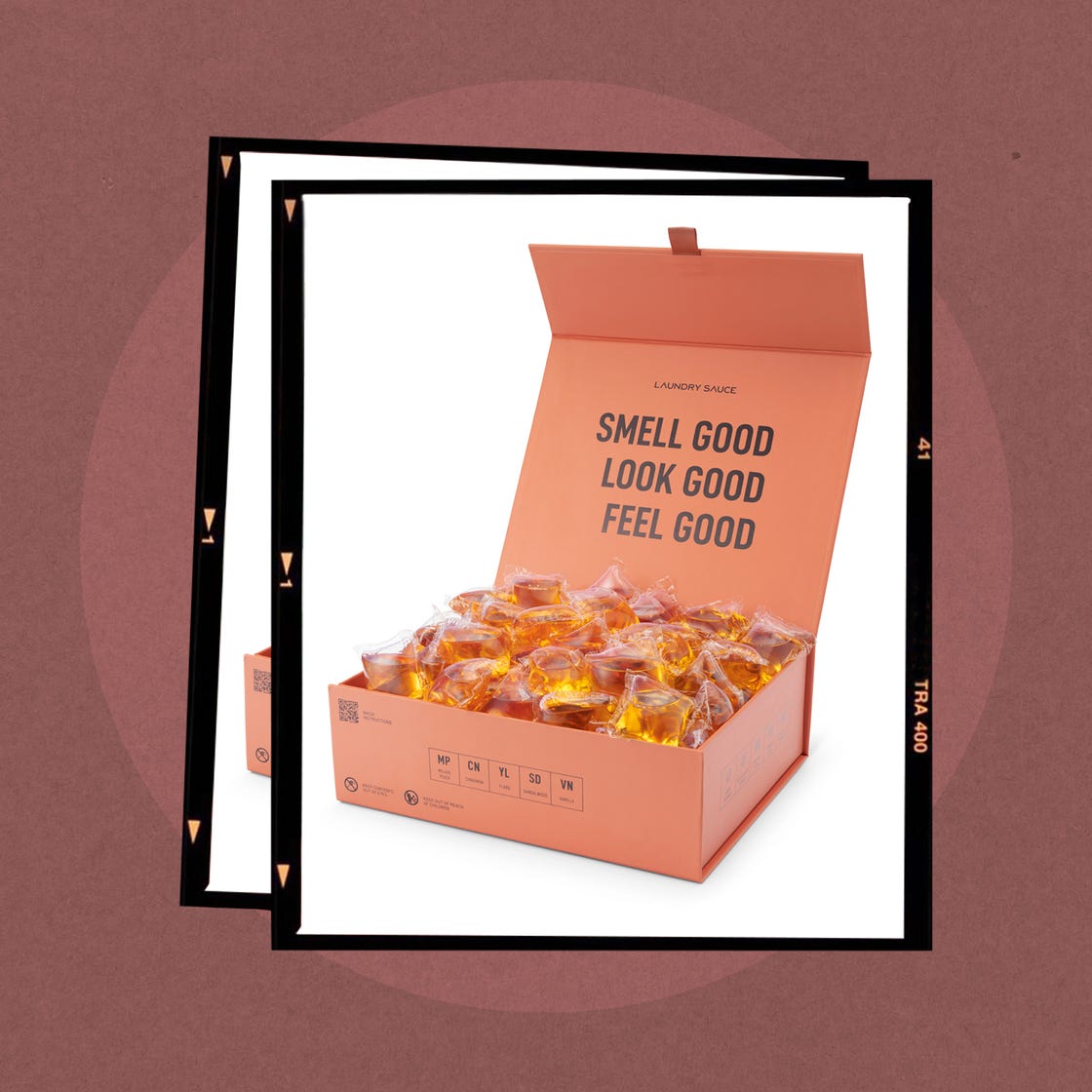 Box containing laundry pods with motivational slogans.