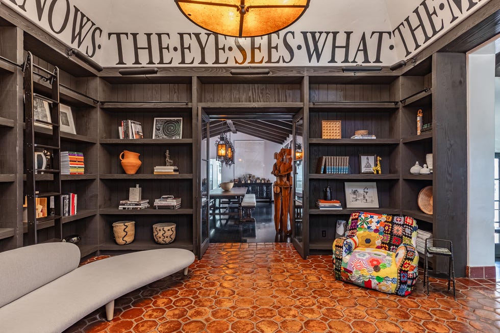 Cozy reading nook with a bookshelf and unique decor.