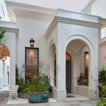 Architectural entryway featuring arched doorways and greenery. Architectural entryway featuring arched doorways and greenery.