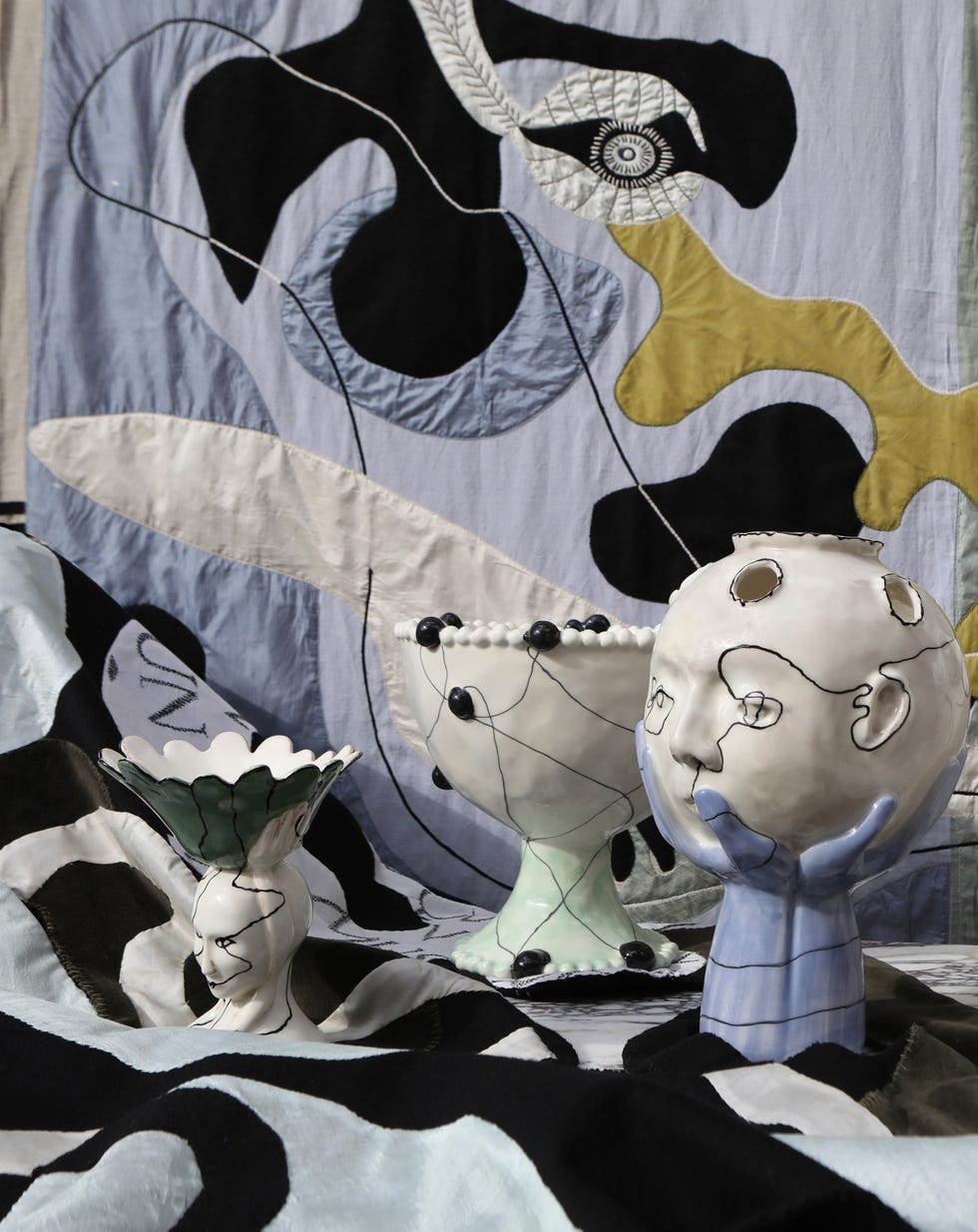 sculptural ceramics and embroidered tapestries from the house of quentin jones debut collection.