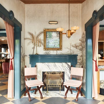 Cozy entryway featuring a fireplace and decorative elements.