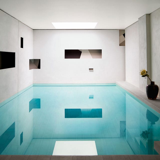 A-List 2024 - ELLE DECOR a blue swimming pool in a modernist room