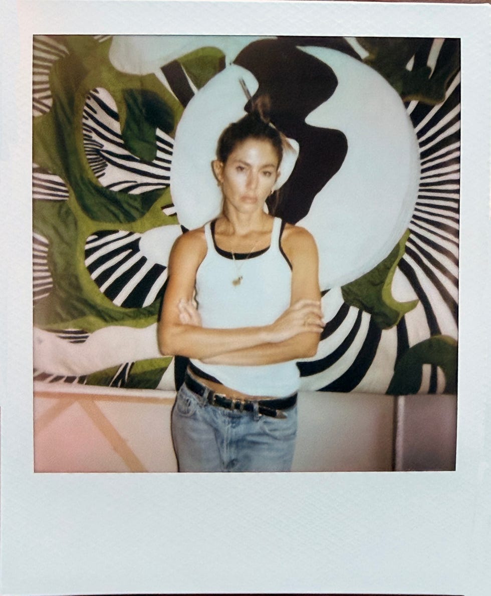 artist quentin jones poses for a polaroid portrait.