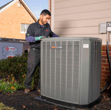 technician with hvac system
