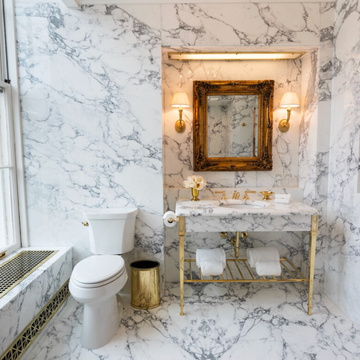 Elegant marble bathroom with classic fixtures.