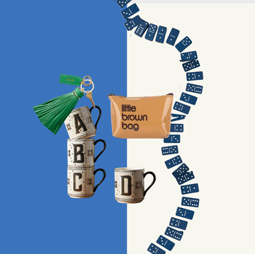 a collection of decorative items including mugs a keychain a pouch and dominoes arranged creatively a collection of decorative items including mugs a keychain a pouch and dominoes arranged creatively